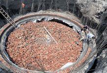 Laborers are working during the construction work of underpass at Samanabad