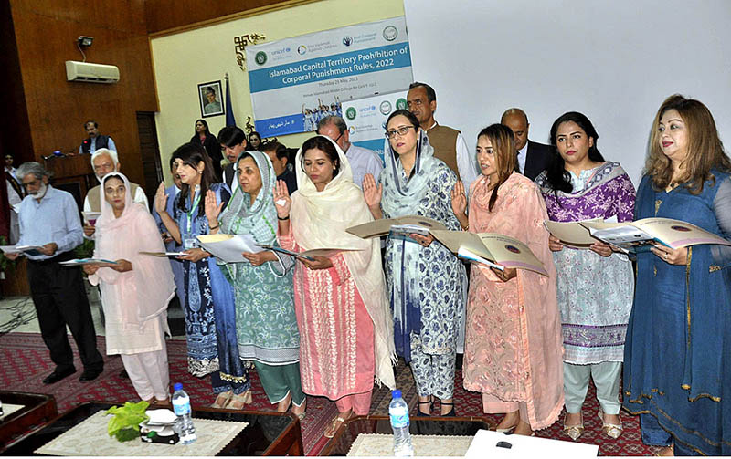School management and teachers are taking the pledge on the occasion of the Launching of Islamabad Capital Territory Prohibition of Corporal Punishment Rules at Islamabad Model College for Girls