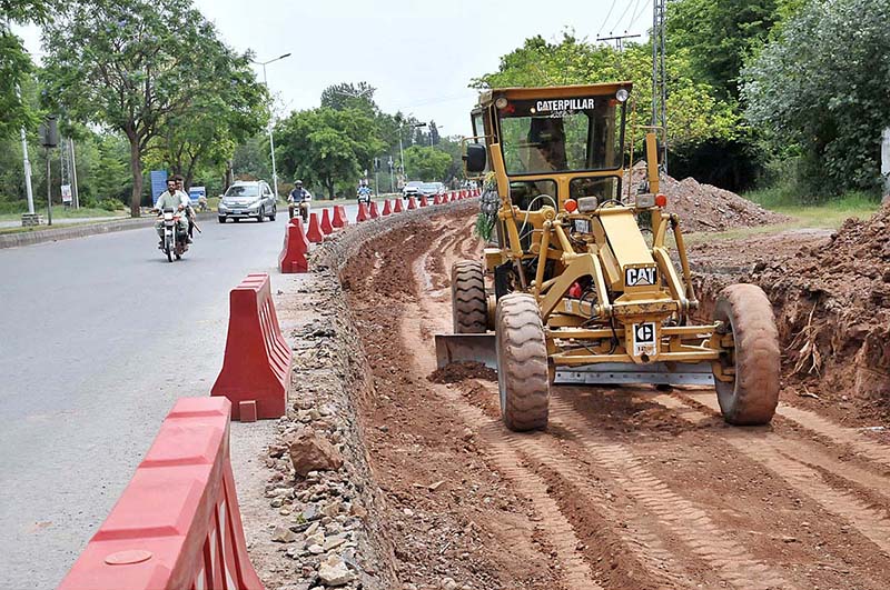 Machinery being used for extension work of Park Road during development work in Federal Capital