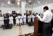 Returning officer Abdul Aziz Dhot taking Oath at Oath talking ceremony of newly Elected Union Committee Chairman, Vice Chairman and Consolers at Noor Muhammad High School