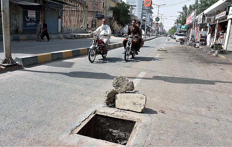 A view of open manhole on the Railway Station Road