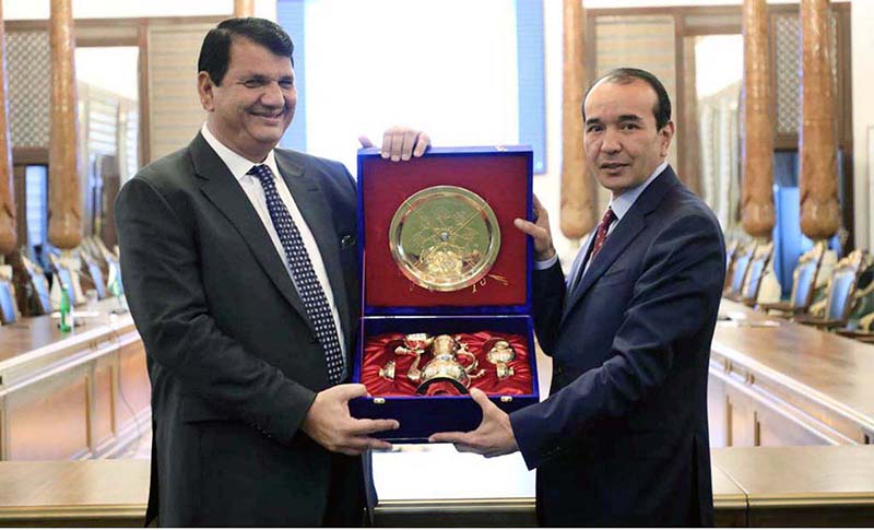 Uzbek Counterpart, Minister for Culture and Tourism H.E. Ozdobek Nazarbekov presenting souvenir to Engr. Amir Muqam, Adviser to Prime Minister for Political, Public Affairs, National Heritage and Culture at the sideline meeting at III Bakhshi International Festival, being convened in city of Gulistan