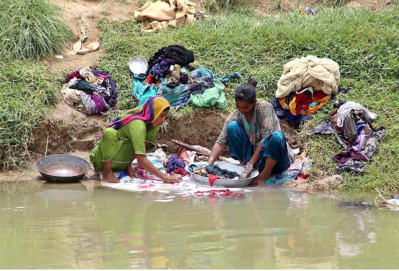 Gypsy woman washing clothes at Channel Mori Canal