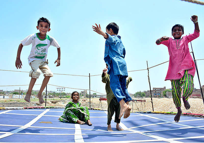 Children jumping on the jumping jack at near Railway Station