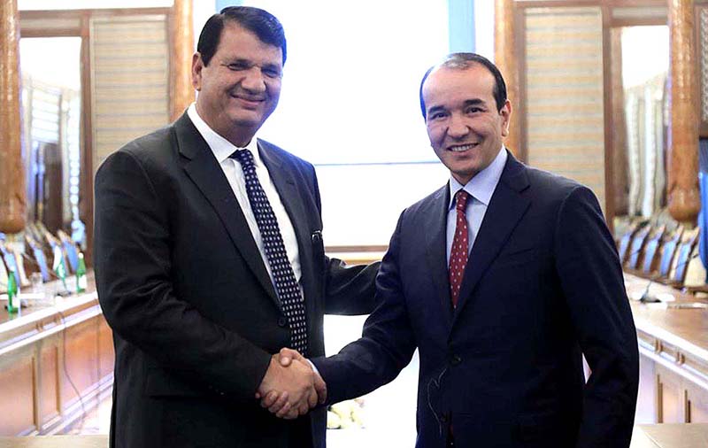 Uzbek Counterpart, Minister for Culture and Tourism H.E. Ozdobek Nazarbekov presenting souvenir to Engr. Amir Muqam, Adviser to Prime Minister for Political, Public Affairs, National Heritage and Culture at the sideline meeting at III Bakhshi International Festival, being convened in city of Gulistan