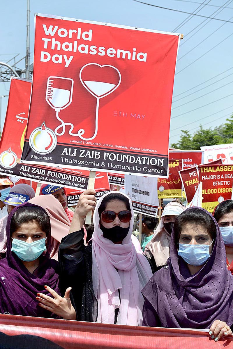 Peoples form different organizations are participating in a walk on the eve of World Thalassemia Day organized by Ali Zaib Foundation at Zila Council Chowk