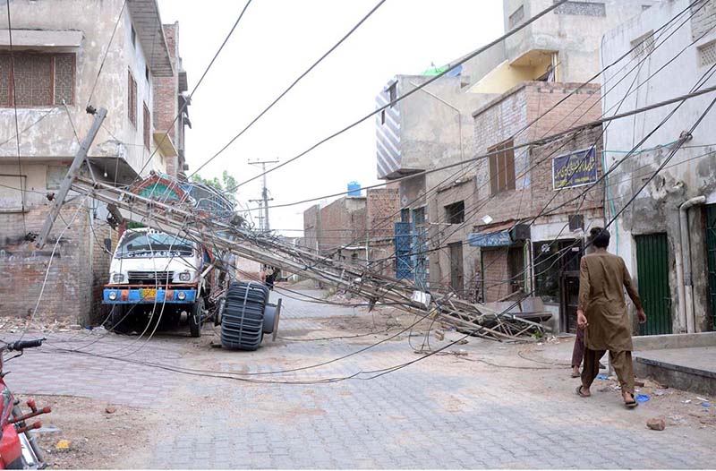 The unattended electric pole that fell two days ago at the Old Vegetable Market in Hassan Parwana Colony poses a potential accident hazard, demanding immediate attention from the relevant authorities