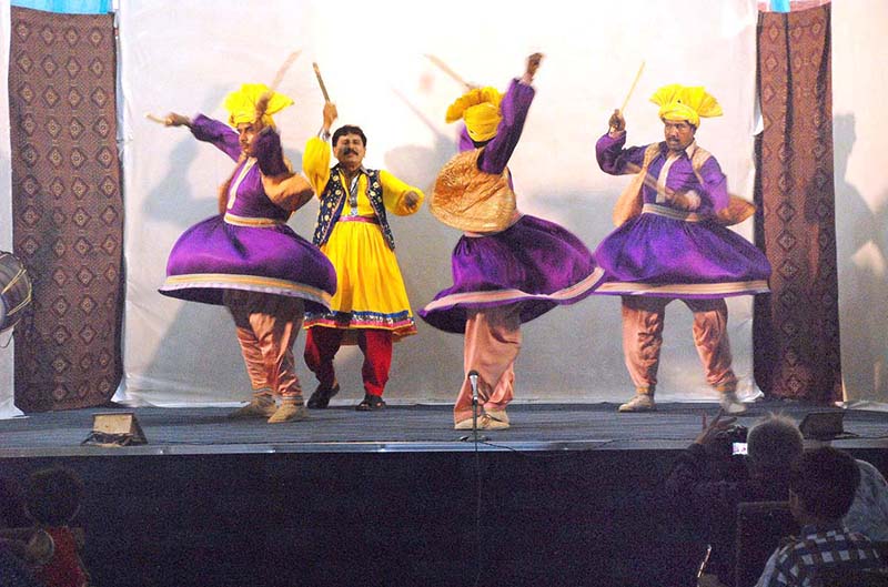 Artists performing traditional jhoomar dance on stage drama watan ke sipahi at the Arts Council