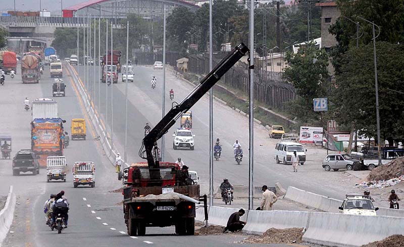 CDA Workers installing new pole lights at IJP Road