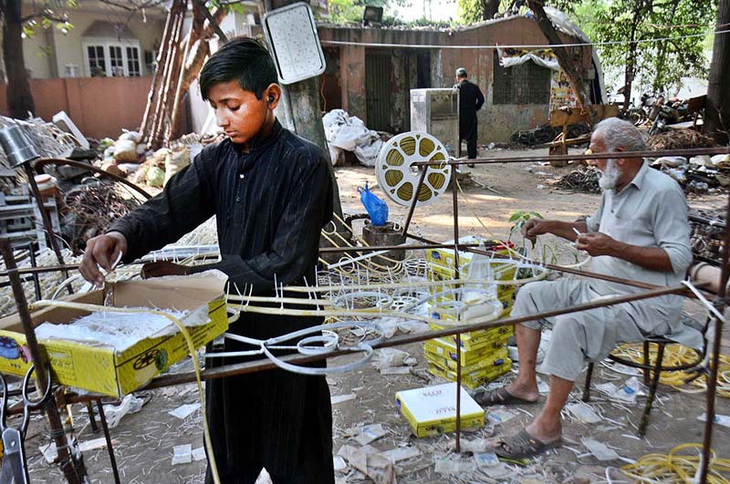 A PHA worker makes materials of decoration for canal and mall road