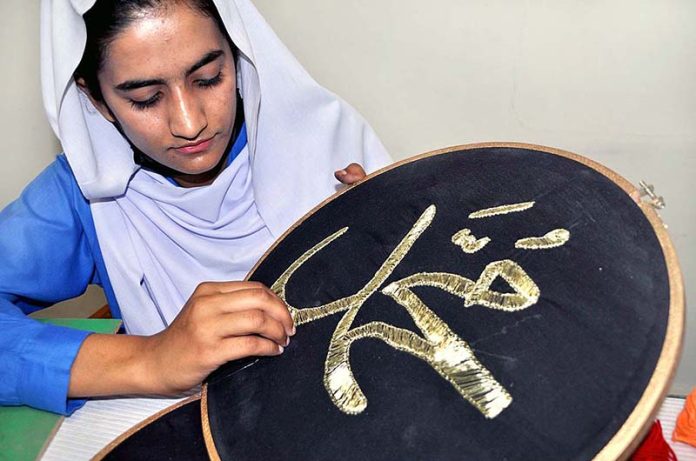 Special Students showing her skill work during fragrance of special Students an Art & vocational Exhibition of Students with Disabilities at University of Sargodha