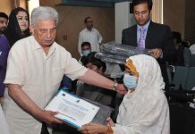 Federal Minister for Education & professional Training Rana Tanveer Hussain distributing wheelchairs to the participants of Prime Ministers Electric wheelchair Scheme for University Students: Distribution Ceremony - Phase 111 organized by Higher Education Commission at HEC
