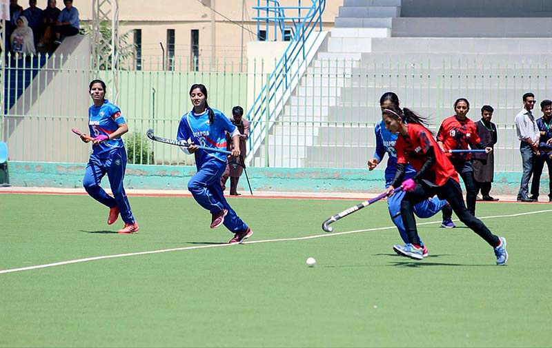 Players in action during match between Pakistan Army and WAPDA Women Hockey team under 34the National Games
