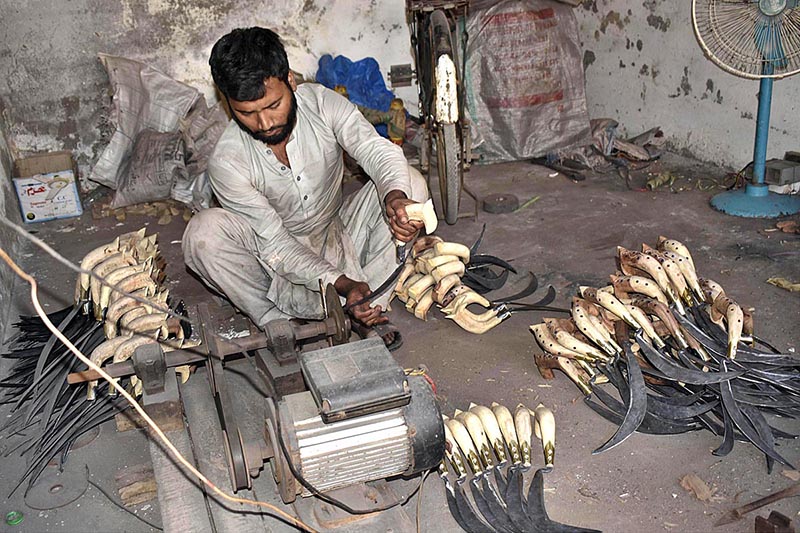 A blacksmith preparing agriculture appliances (Darantis) at his workplace