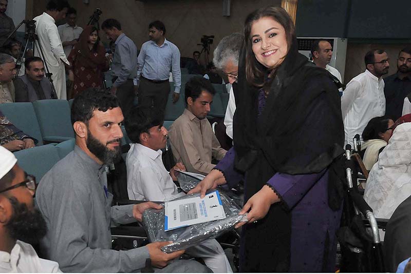 Parliamentary Secretary for Education, Professional Training Zeb Jaffar distributing wheelchairs to the participants of Prime Ministers Electric wheelchair Scheme for University Students: Distribution Ceremony - Phase 111 organized by Higher Education Commission at HEC