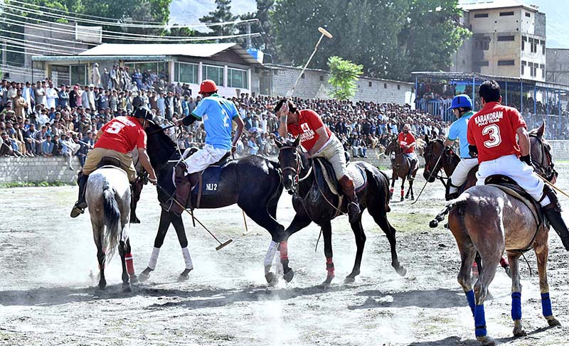 Players struggling to get hold on the ball during the polo match between Karakoram and NLI teams at Shahi polo ground