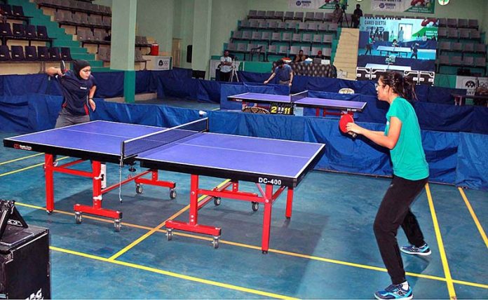 Players exhibit their skills during a match between Pakistan Army and HEC during a 34th national games being played at Ayub Stadium