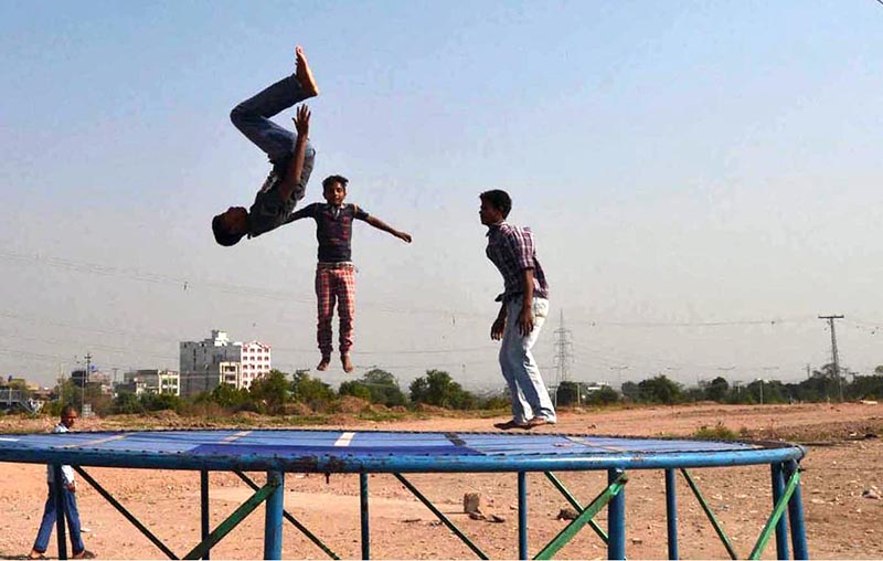 Young boys jumping on a trampoline