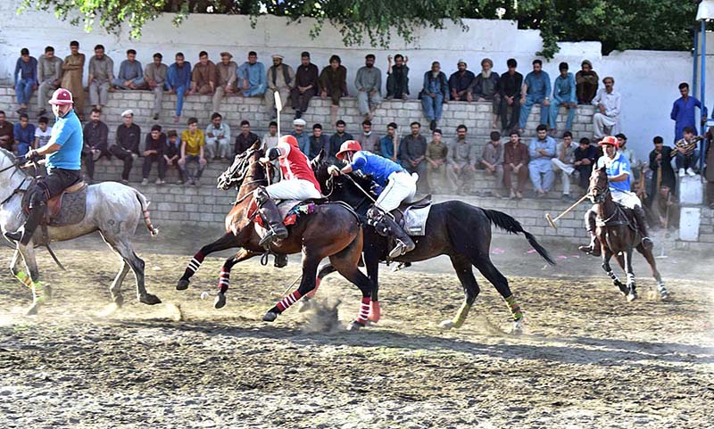 Players struggling to get the ball during Polo match at Shahi polo ground