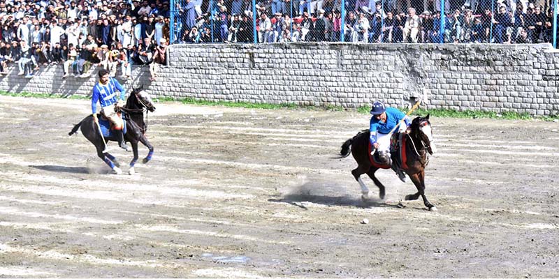Players struggling to get hold on the ball during the polo match between Punyal and Shigar teams at Shahi polo ground