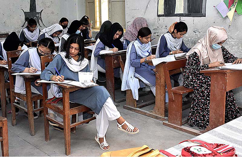 Students solving paper during their annual examination of SSC (Part-II) 10th class at Government Girls High School