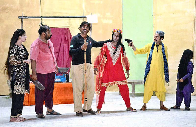 Artists performing on stage in drama "kalu kasai" presented by Arts Council of Pakistan at ZA Bhutto Open Air Theater