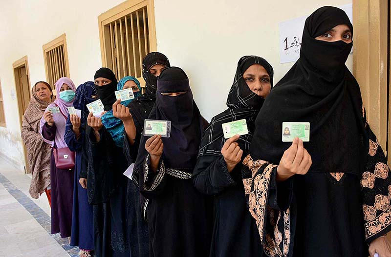 A female voter casting her vote in a polling station during the Local Government by-elections in the metropolis