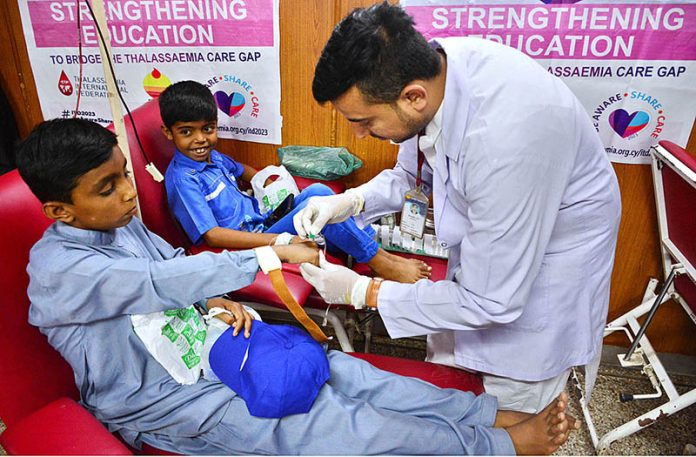 Children with thalassemia is receiving blood on International Thalassemia Day at Fatimid Foundation Center