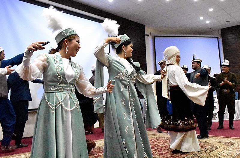 Artist of Kyrgyz presenting traditional Kyrgyz dance during the "Kyrgyz History and Cultural Show" organized by the Embassy of Kyrgyz Republic Pakistan and Overseas Kyrgyz Association Pakistan at Musharaf Hall Karakoram International University