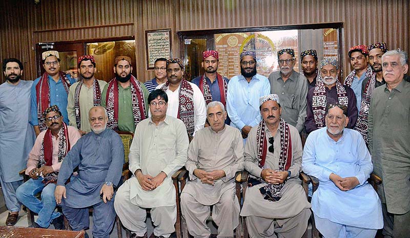 President Larkana Chamber of Commerce and Industry Ahmad Ali Shaikh in a group photo with newly elected officers of the Press Photographers and Cameramen Association, President Nadeem Akhtar Soomro and other during hosting a reception at Chamber Office