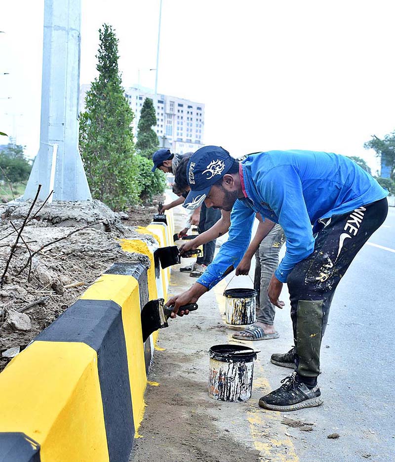 While the world commemorates International Labour Day, painters are busy painting the roadside