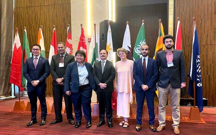 A group photograph of Secretary Workers Welfare Fund, Zulfiqar Ahmad at the Asia-Gulf Cooperation Council
