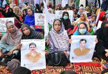 Workers of MQM Pakistan participating in a demonstration to show solidarity with Pakistan Army outside Press club