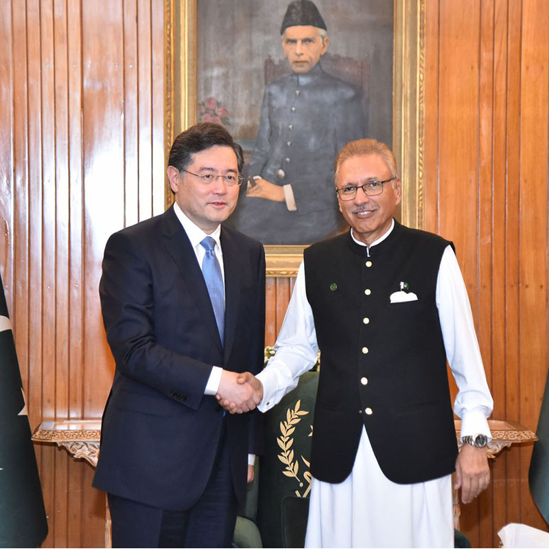 President Dr. Arif Alvi, shaking hands with the State Councilor and Minister of Foreign Affairs of China, Mr. Qin Gang, who called on him at Aiwan-e-Sadr