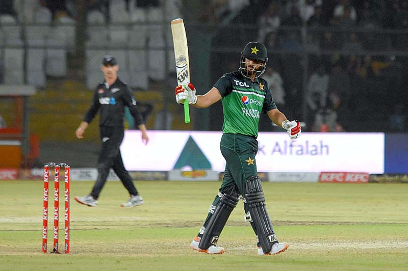 Pakistan's batsman Agha Salman celebrates after scoring a half-century (50 runs) during 5th and final One-Day International (ODI) cricket match between Pakistan and New Zealand teams at the National Stadium