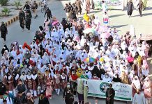 Participants of Youm-e-Takreem-e-Shuhda-e-Pakistan Rally passing through Zarghoon Road organized by students and civil society members to express solidarity with Pakistan Army