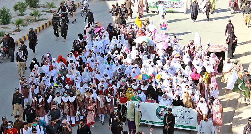 Participants of Youm-e-Takreem-e-Shuhda-e-Pakistan Rally passing through Zarghoon Road organized by students and civil society members to express solidarity with Pakistan Army