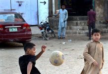 Children playing football in Mehmoodabad area