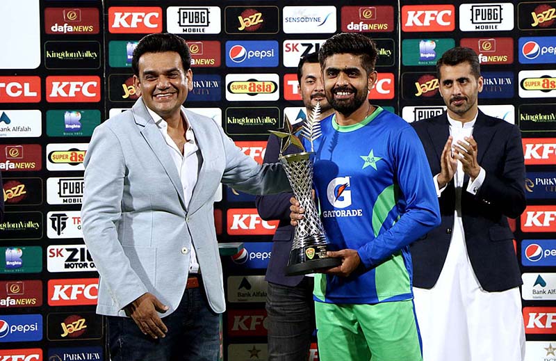 Pakistan cricket team captain Babar Azam receiving winning trophy after winning five matches One-Day International (ODI) series against New Zealand at the National Cricket Stadium