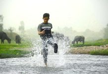 Youngster enjoying in a local stream to get some relief from hot weather in the Phandu Area