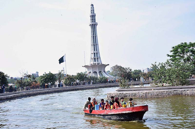 Families enjoying a boat ride at Minar e Pakistan's Greater Park