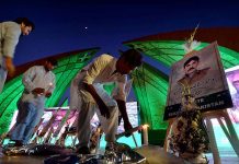People lit up candles to show solidarity with the families of martyrs at the Pakistan Monument, illuminated with green lights in connection with observing Youm-e-Takreem-e-Shuhada-e-Pakistan