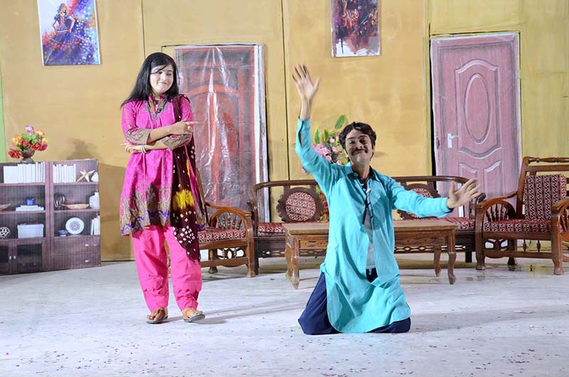 Artists performing on stage in drama "Abhi to Mein Jawan Hon" presented by Arts Council of Pakistan at ZA Bhutto Open Air Theater