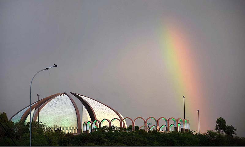 A mesmerizing view of rainbow over the Pakistan Monument after thunder storm in the city