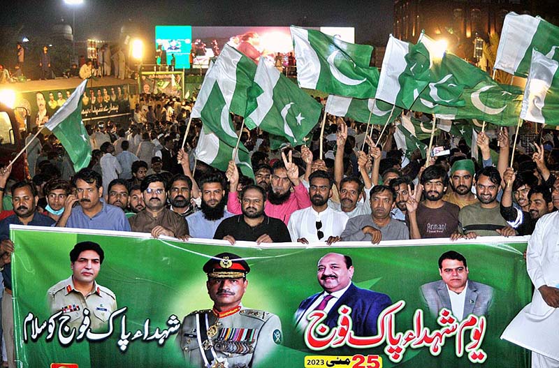 People from different walks of life participating in a walk rally to express solidarity with the Pak Army on the day of Youm-e-Takreem-e-Shuhda-e-Pakistan at Ghanta Ghar