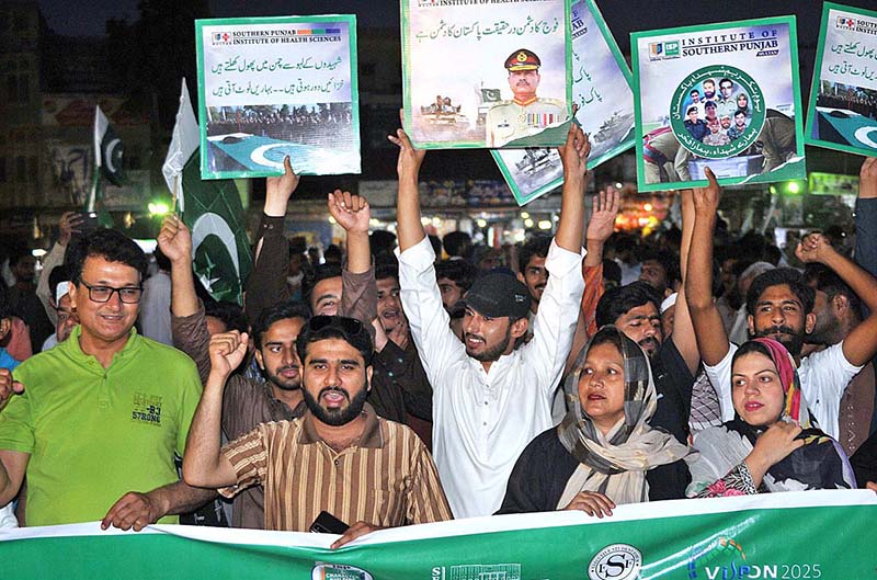 People from different walks of life participating in a walk rally to express solidarity with the Pak Army on the day of Youm-e-Takreem-e-Shuhda-e-Pakistan at Ghanta Ghar