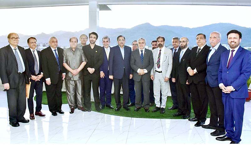 A delegation of Federation of Pakistan Chamber of Commerce & Industry (FPCCI) headed by its President Mr Irfan Ahmad Shaikh pose for group photo during their meeting with Federal Minister for Finance and Revenue Senator Mohammad Ishaq Dar at FBR (Hqrs)