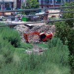 Heavy machinery being used to clean a nullah at Kuri Road