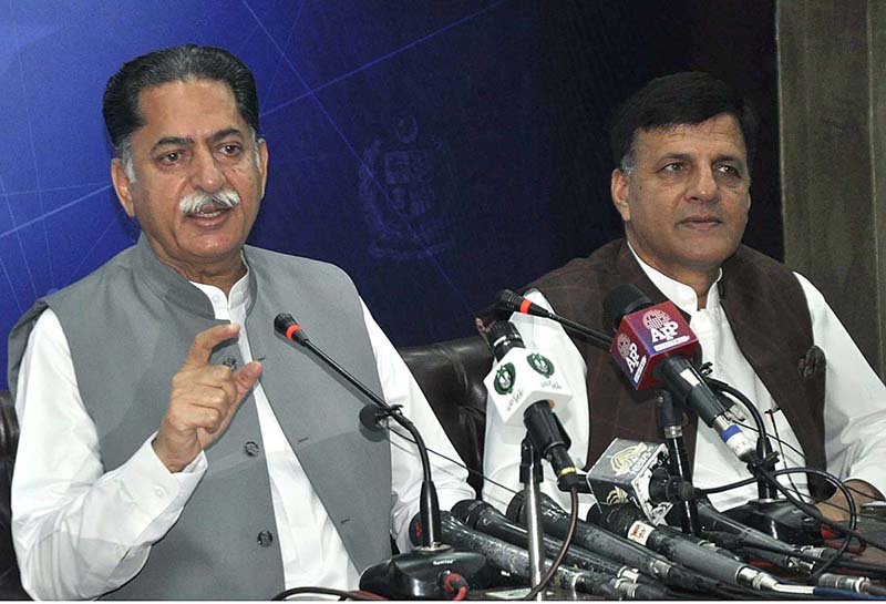 Federal Minister Mian Javed Latif is addressing a press conference at PID Media Center