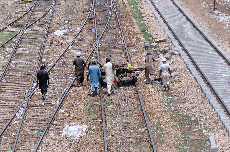 Railway staffers are busy replacing wooden sleepers with PSC sleepers on the railway tracks
